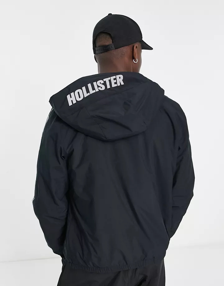 Chaqueta deportiva negra con capucha, banda del logo y forro de sherpa de Hollister Negro 1wUgKVer