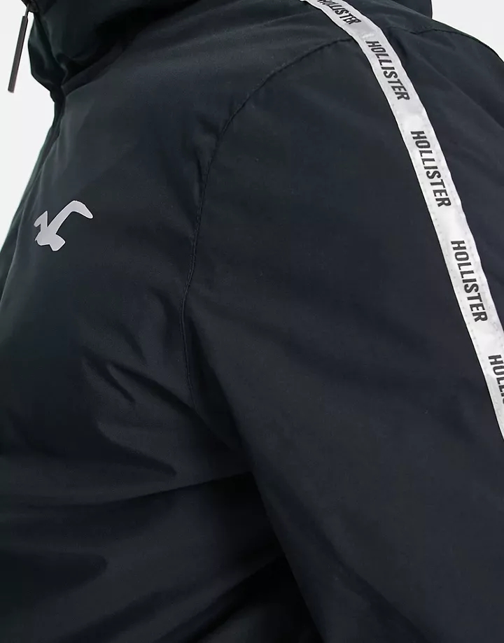 Chaqueta deportiva negra con capucha, banda del logo y forro de sherpa de Hollister Negro 1wUgKVer