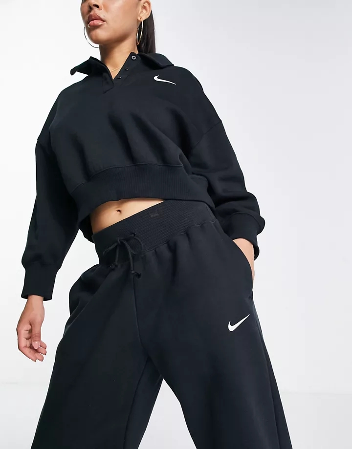 Joggers negros y blancos extragrandes de talle alto con logo pequeño de Nike Negro 9u9KNSmA